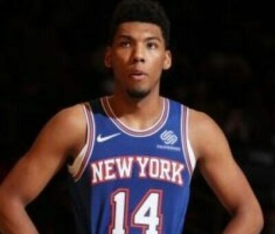 A well-known basketball player named Allonzo Trier previously played for the Iowa wolves in the NBA G League. The trophy for the 12 years' most excellent player went to Allonzo Trier. Value of Allonzo Trier His income as a basketball player is his main source of income. As of February 2023, his net worth ranged from $1 million to $3 million. Wiki Allonzo Trier Marcie Trier, a social worker who is a single mother, gave birth to him. On January 17, 1996, Allonzo Brian Trier was born in Seattle, Washington. His mother was a gymnast and a ballet dancer in her adolescence. We don't know anything about Triers' father. He will be 26 years old in 2022 and has the Capricorn astrological sign. He is a citizen of the USA. Regarding his educational background, he spent his junior years at Montrose Christian School. He transferred to Findlay Prep in Henderson, Nevada as a senior. Allonzo Trier Dating, Girlfriend Recent reports state that he is single and not dating anyone. Formerly, he was connected to soccer player Tori Gates. We have no information regarding their relationship, though. The height and weight of Allonzo Trier He is a very tall basketball player, standing 6 feet 5 inches tall and weighing 91 kg. He has a 23.7 BMI. He has brown eyes and black hair. Occupational Life He started playing basketball when he was just seven years old. In addition, he received the school's first Washington Post All-Met honor during his junior year and was voted the 2014 Gatorade State Player of the Year. In 2014, he participated in the FIBA Americas U18 Championship. He was selected for the second team of the 2015 USA Today All-USA during his final year of high school. After going undrafted in the 2018 NBA draft, he later signed a two-way contract with the Westchester Knicks, the Knicks' NBA G League team. However, it has been claimed that he has struggled to make the same progress in the NBA as he did in high school and college. Recent sources claim that he is presently a New York Knicks player. He was chosen by the Iowa wolves of the NBA G League on January 11, 2021. He won the gold medal at the FIBA Americas U18 Championship. After testing positive for PEDs during his second season, he was placed on an indefinite suspension. He was hurt in a traffic collision. After that, on January 20, 2017, he made his 19-game absence from UCLA games during his sophomore season in 2016–2017 up. He was named to the second team All-Pac-12 and the most impressive player of the Pac-12 Tournament. Allonzo Trier